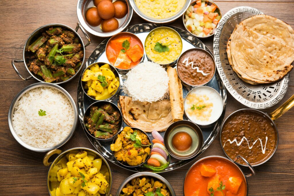 Indian assorted vegetarian food in plate and serving bowls