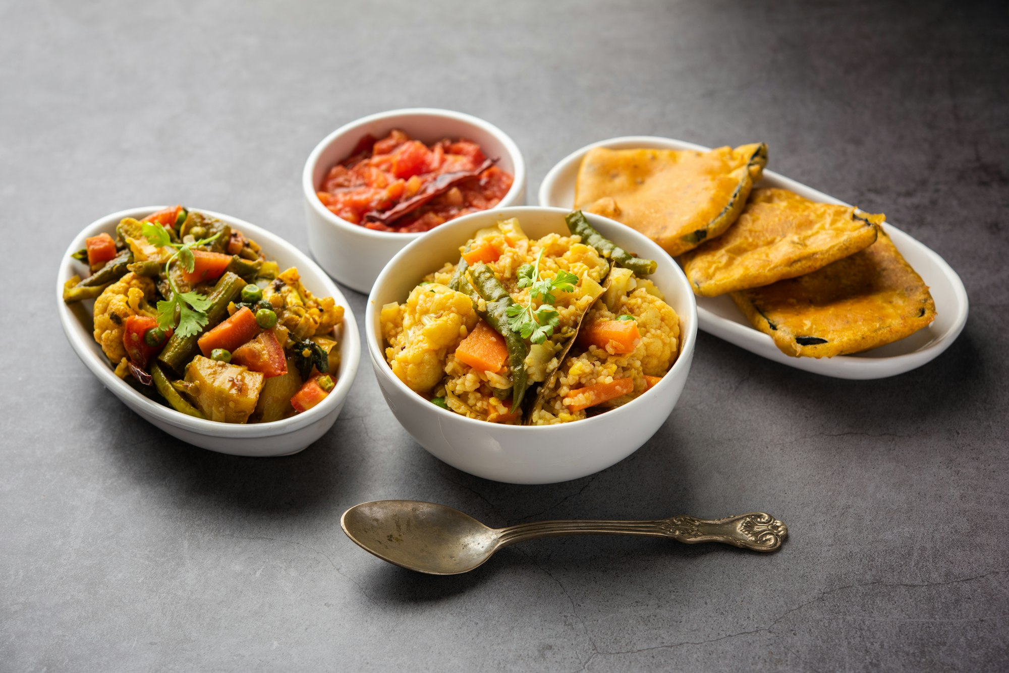 Bengali Bhog food for Indian Hindu Durga Puja or pooja festival. Khichadi, labra, tomato chutney